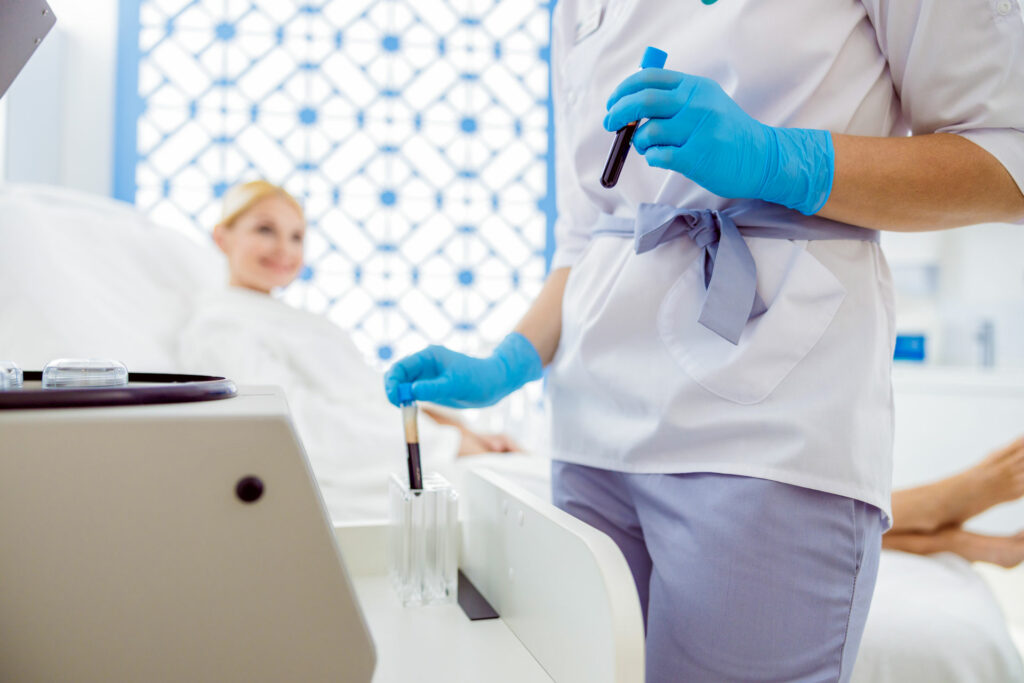 aesthetician prepares patient's blood for prp, prf or pbf cosmetic treatment